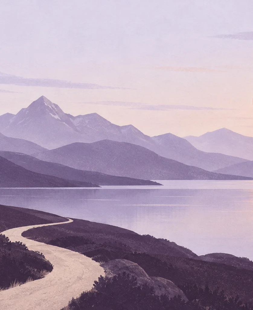 An open path follows a still lavender lake toward distant mountains.